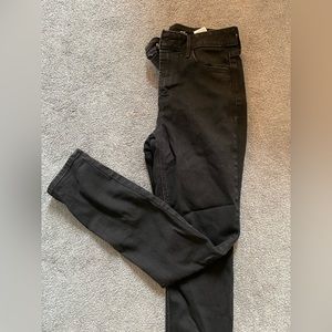 Black pair of high-rise straight legged jeans. Size: 4